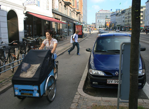 IMG_0512_bikelane_inside_parkedcars.jpg