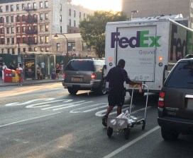 Double-parking like this will likely continue under changes to the Stipulated Fine Program, but at least the city will start charging trucking companies for doing it. Photo: Stephen Miller