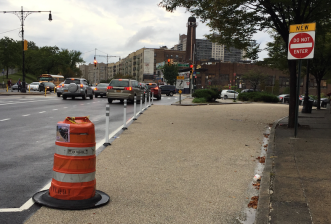 DOT recently made safety improvements on the Grand Concourse below 158th Street, including this closed-off slip lane outside Cardinal Hayes High School, but bike lanes were not included. Image: DOT