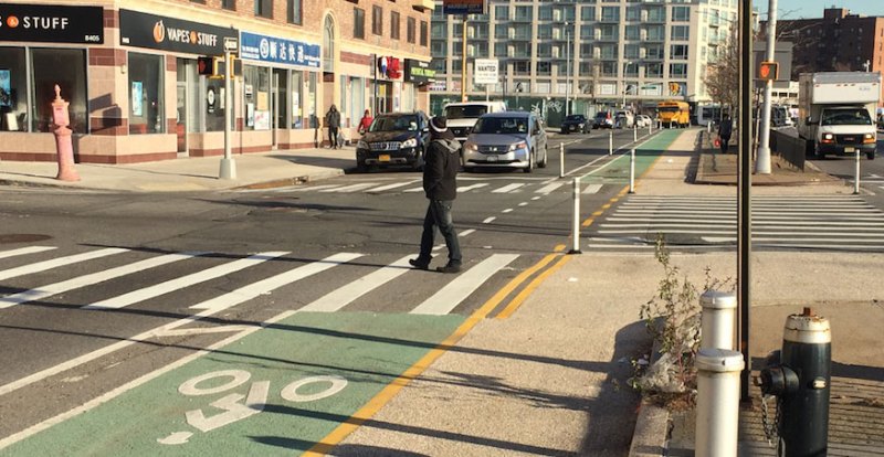 The new bike lane, expanded pedestrian space, and mall-to-mall crosswalk at Van Loon Street.