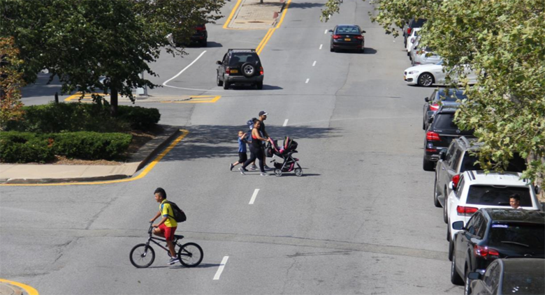 The current design of 111th Street forces Corona residents to run for their lives to get to the biggest park in Queens. Photo: NYC DOT