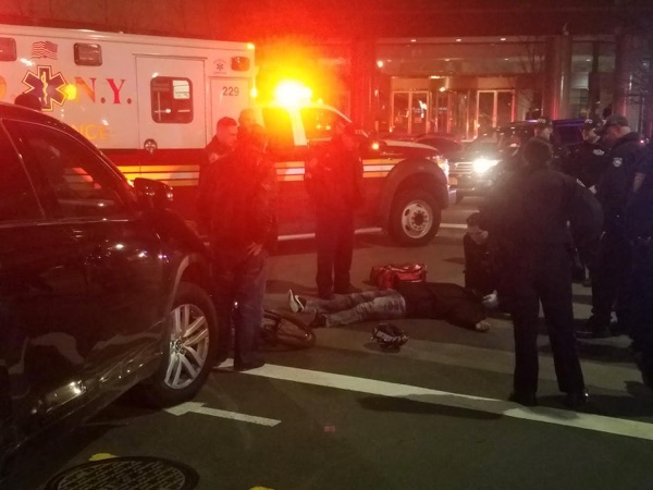 A for-hire driver in an Uber cab hit a cyclist on the Hudson River Greenway at Liberty Street, rendering the victim unconscious. Photos: Adam White