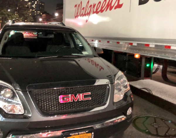 A vehicle bearing a Bronx-assigned DOE placard parked in a loading zone on Flatbush Avenue in Brooklyn. Photo: @jooltman