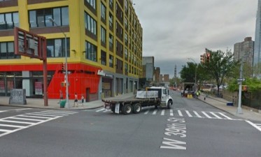 Maria Munez-Carna was struck by a flatbed truck driver making this turn from 10th Avenue onto W. 39th Street, toward the Lincoln Tunnel. Image: Google Maps