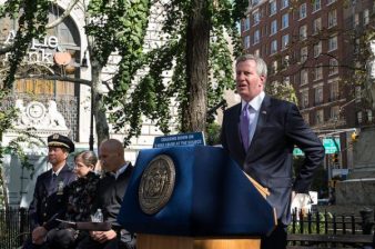 That's NYPD Transportation Bureau Chief Thomas Chan at the far left in this picture with his boss, Mayor de Blasio back in 2017, when Chan and Hizzoner were boasting of their e-bike crackdown. Photo: Edwin J. Torres/Mayoral Photography Office