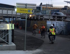 Workers biking on the 94th Street walkway to LaGuardia's central terminal. Photo: Aazam Otero