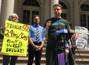 Riders Alliance director John Raskin speaks outside City Hall this afternoon. Photo: David Meyer