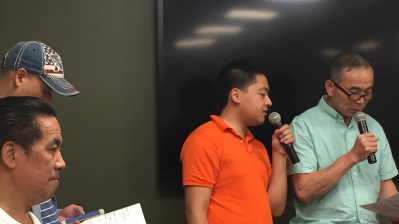 Delivery worker Hongjian Lin, 54, far right, received seven tickets for using his e-bike this month alone. Photo: David Meyer