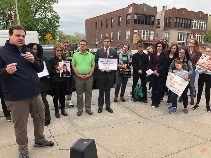 Senator Marty Golden's chief of staff, John Quaglione (holding mic), said Golden supports a bill to double the number of speed cameras permitted on NYC streets. Photo: Ben Fried