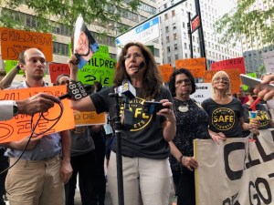 Amy Cohen speaking during a rally.
