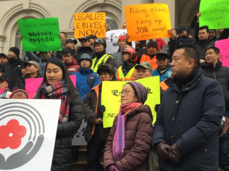 Council Member Margaret Chin (center, pink scarf) speaking alongside delivery workers and allies in December. Photo: David Meyer