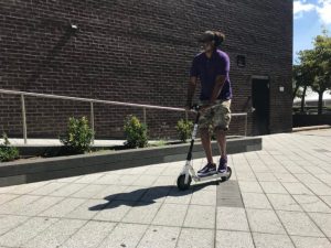 Council Member Robert Cornegy rides a Bird e-scooter at a demonstration in 2018. Photo: Gersh Kuntzman