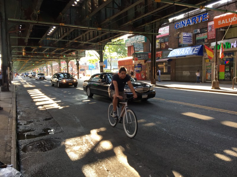 Some business owners object, but Roosevelt Avenue has been far less congested under a city plan to eliminate curbside parking during rush hours. Photos: Laura Shepard