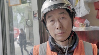 Chinese food delivery worker Deqing Lian spoke to Streetsblog. Photo: Jing Wang