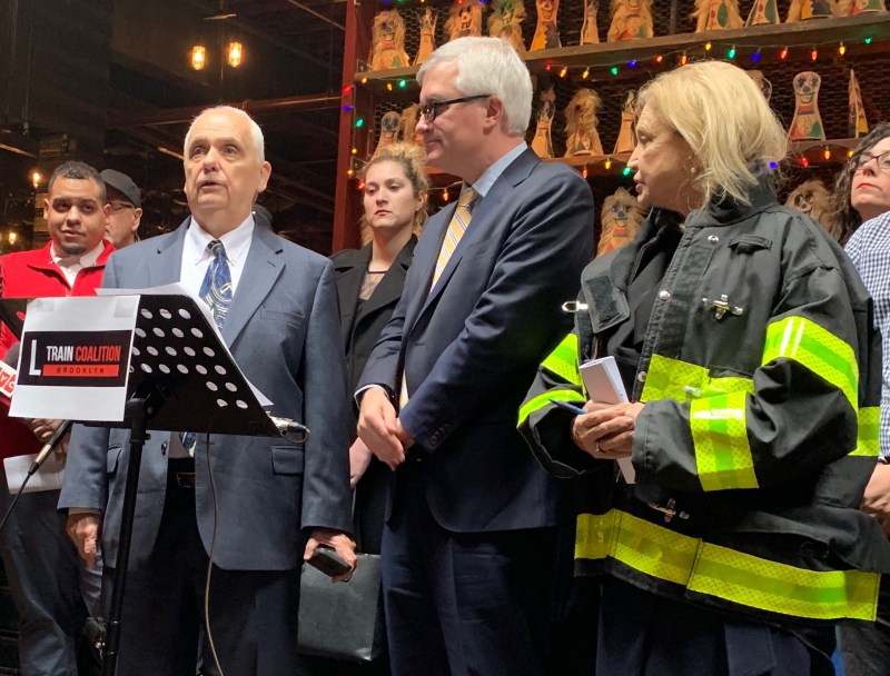 Assembly Member Joe Lentol, at podium, with North Brooklyn electeds and businesses on Friday. Photo: David Meyer