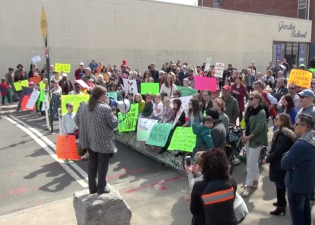 Hundreds rallied in 2019 for the city to make good on its promise to close all of 78th Street in Jackson Heights to car traffic. A car dealership on the block has gotten around that pledge. Photo: Clarence Eckerson Jr.