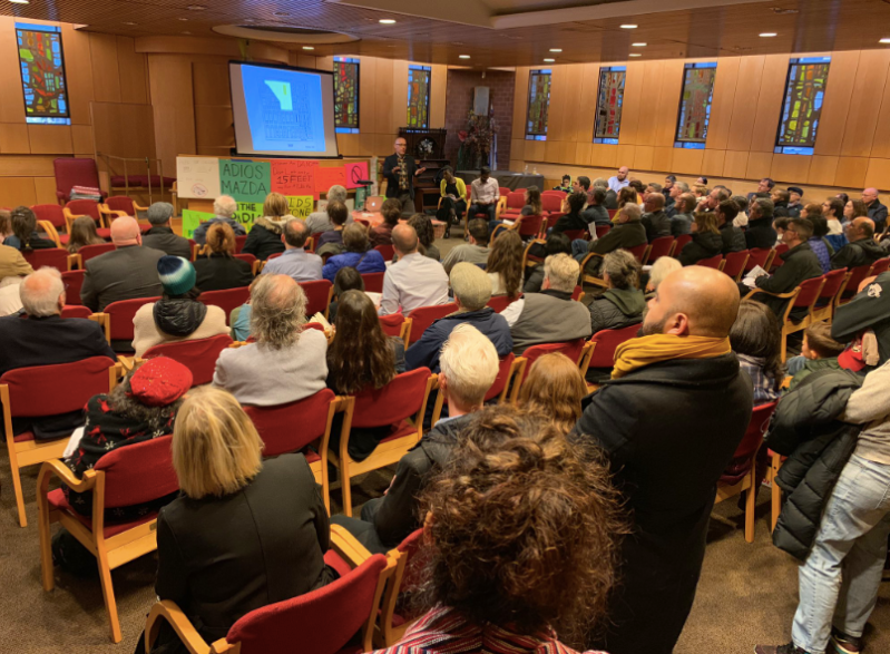 An overflow crowd came out on Monday night to plan a strategy for getting the city to make good on its promise to turn 78th Street in Jackson Heights into a park. Photo: Clarence Eckerson Jr.