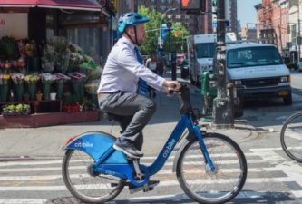 Council Speaker Corey Johnson on a Citi Bike.