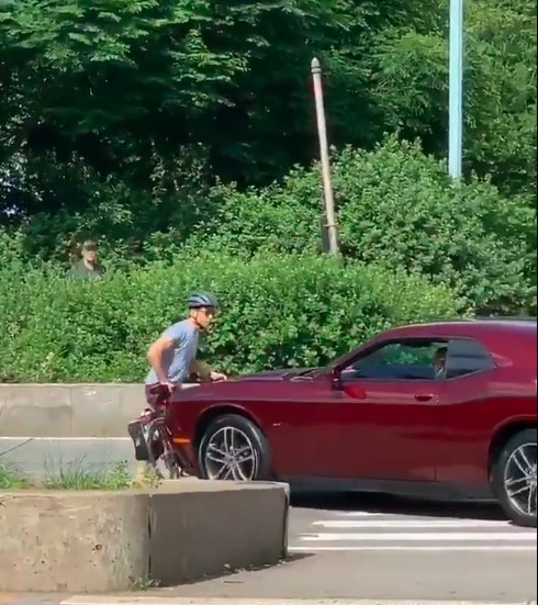 The driver trying to kill the biker. Photo: Barstool Sports.