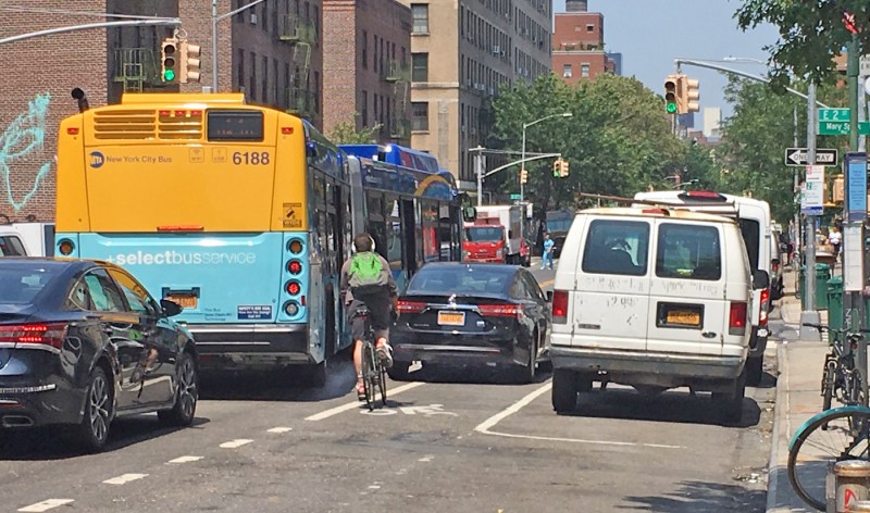 A cyclist experiences the fresh hell of Avenue A, which has only a painted bike lane. Photo: Vivian Lipson