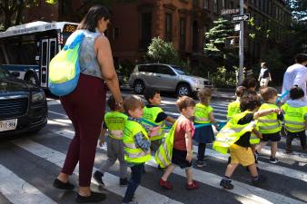 Children are escorted across Lafayette Avenue in Clinton Hill last year. Photo: Bess Adler