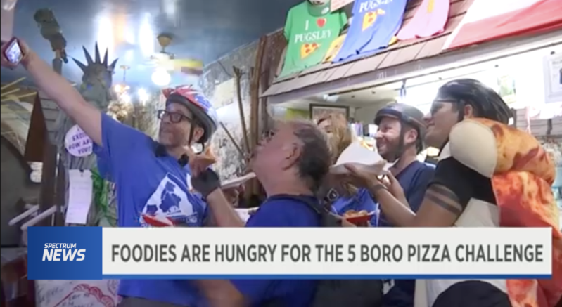 NY1 covered the Five Borough Pizza Challenge — and prominently featured a team that included our editor (taking selfie at left).