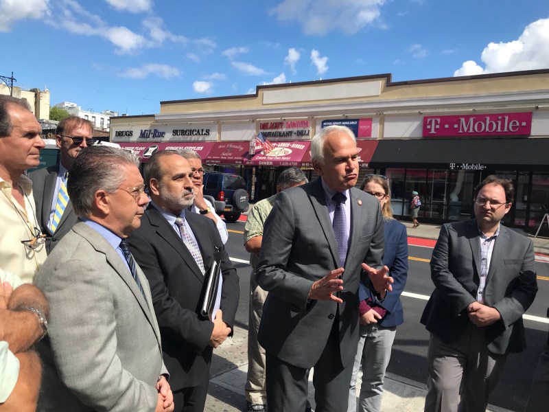 Council Member Bob Holden (gesturing) joined opponents of the Fresh Pond Road bus lane at a presser on Wednesday. Photo: Dave Colon