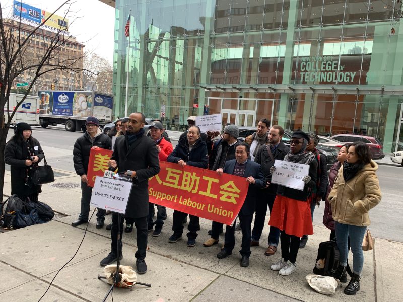 It's beginning to look a lot like ... frustration. Transportation Alternatives Co-Deputy Director Marco Connor (foreground) rallied with delivery workers to demand that Gov. Cuomo sign a hugely popular bill legalizing e-bikes. Photo: Gersh Kuntzman