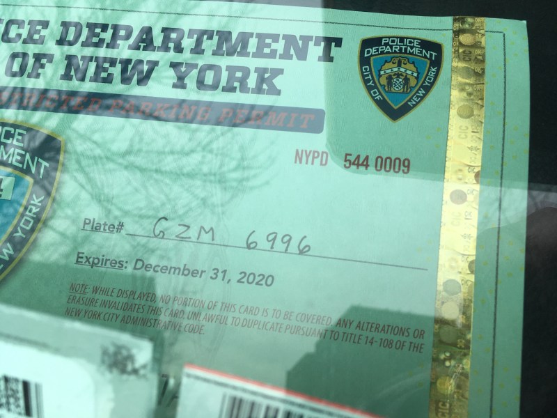 The SUV on which this police placard was displayed this week had seven school-zone speed-camera and five other violations dating back to 2015. Photo: Eve Kessler