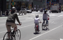 Is that a KID biking in Times Square? Why not? Photo: Clarence Eckerson Jr.