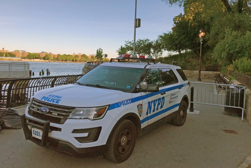 An NYPD SUV blocks open space inside Carl Schurz Park at around 90th Street, making it impossible for pedestrians and ferry riders to walk south. Photo: Steven Vago