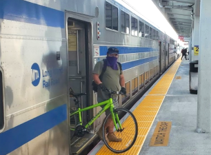 An LIRR passenger detraining with a bike at Hicksville. Photo: The LIRR Today