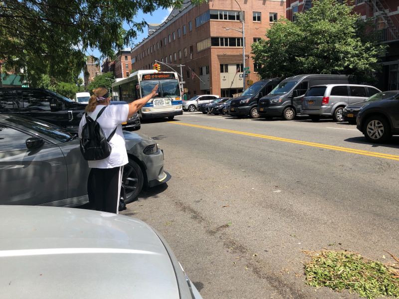 Residents of Harlem have to "hail" a bus on Frederick Douglass Boulevard. Photo: Adam Light