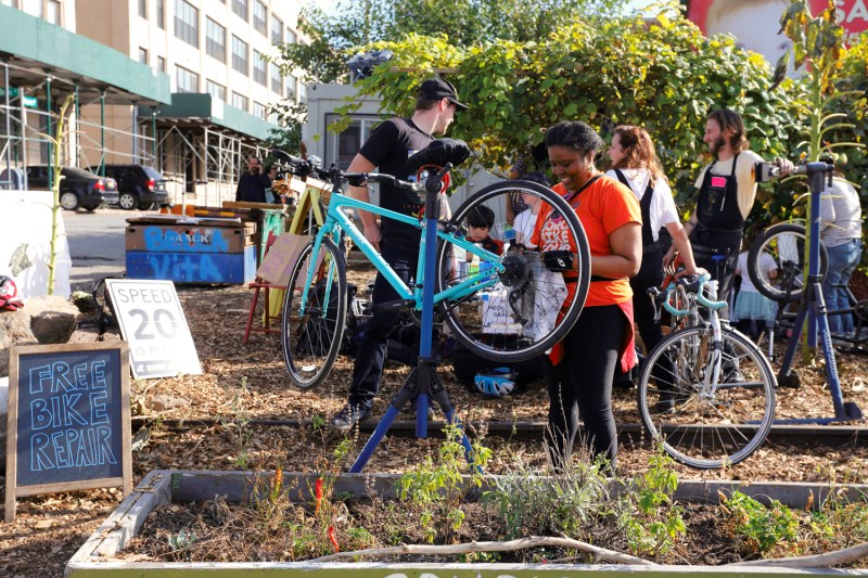 Look at the peaceful happiness you can achieve just from working on a bike. This could be you! Photo: Mechanical Gardens Bike Co-op