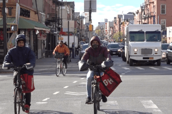 It's all legal: Notice the "walk" signal? That means cyclists can go ahead of cars — eliminating the possibility of a right hook. Photo: Clarence Eckerson Jr.