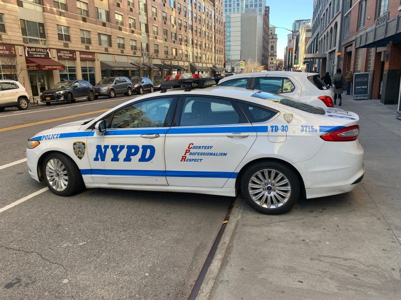 The double-whammy: Parked on the sidewalk and in the bike lane. Photo: Gersh Kuntzman