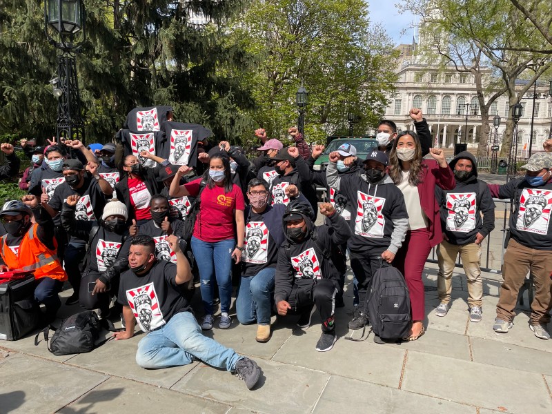 Deliveristas rally at City Hall Park for a package of City Hall bills that would regulate delivery apps. Photo: Dave Colon