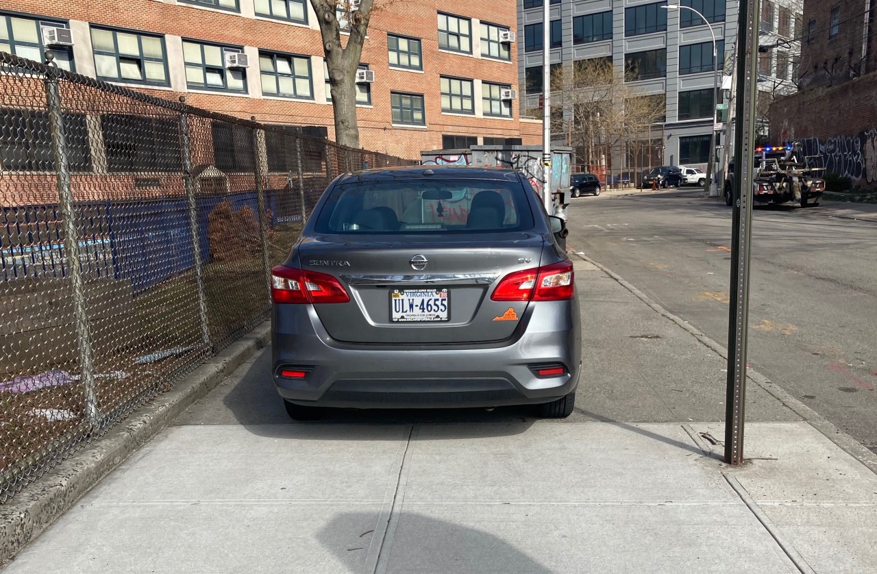 This illegally parked car had an old teacher ID as a "placard." Photo: Mars van Grunsven
