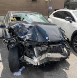 The wreckage of the car that killed Xing Long Lin back in April in Astoria. File photo: Julianne Cuba