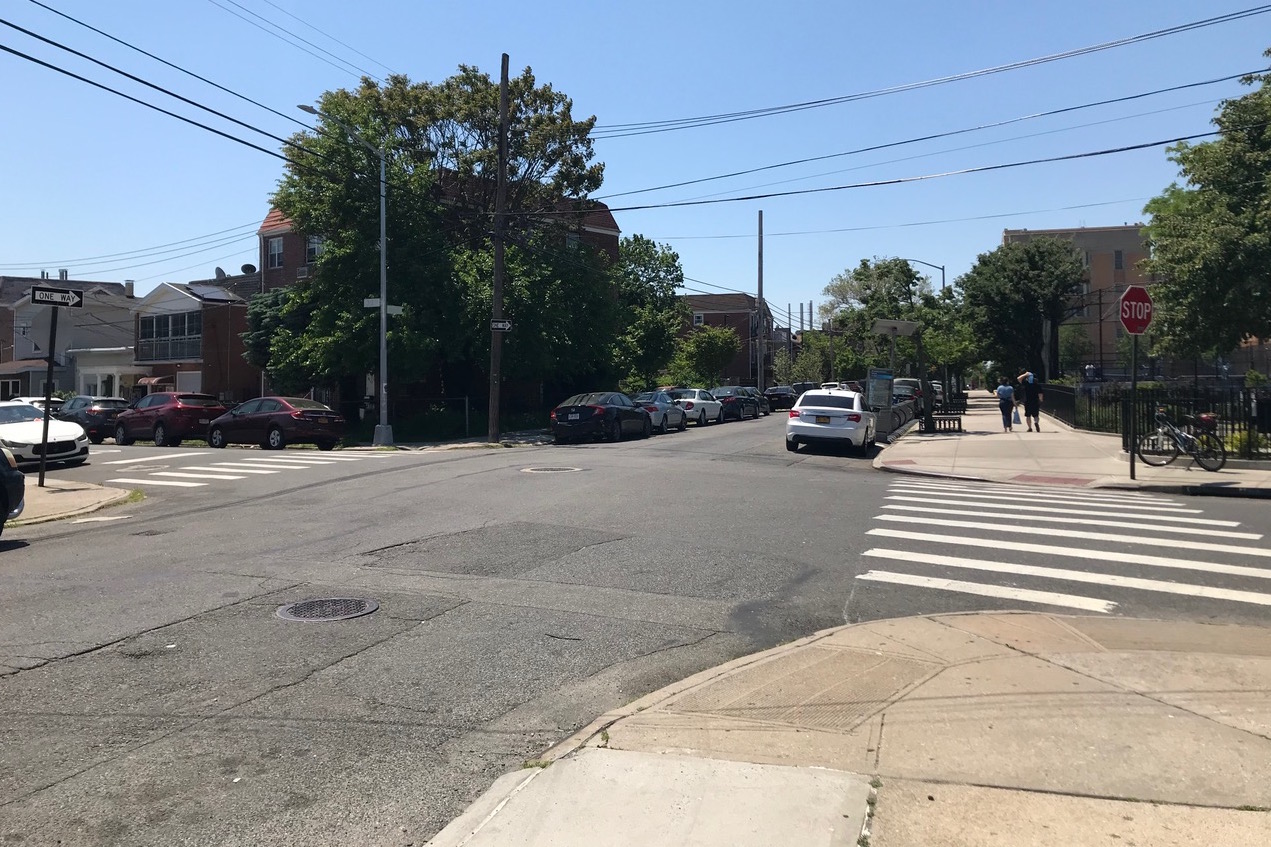 A curb cut to nowhere outside of the northeast park entrance (seen right) lets cars park next to the Citi Bike dock. Also, there is no stop sign on the street behind me. Photo: John Surico