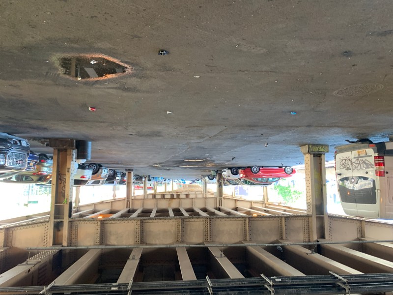 What a great place for a two-way bike lane and less parking! The parking lot under the Brooklyn-Queens Expressway between Morgan and Sutton. Photo: Gersh Kuntzman