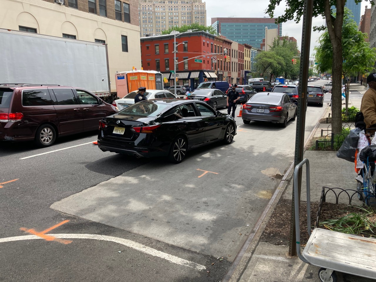 Police on Tuesday checked dark sedans like the vehicle that killed Mitchell on Atlantic Avenue. Photo: Henry Beers Shenk