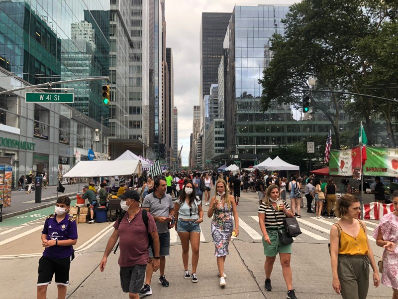 Crowds of people enjoy a street fair on 6th Avenue on July 18th.