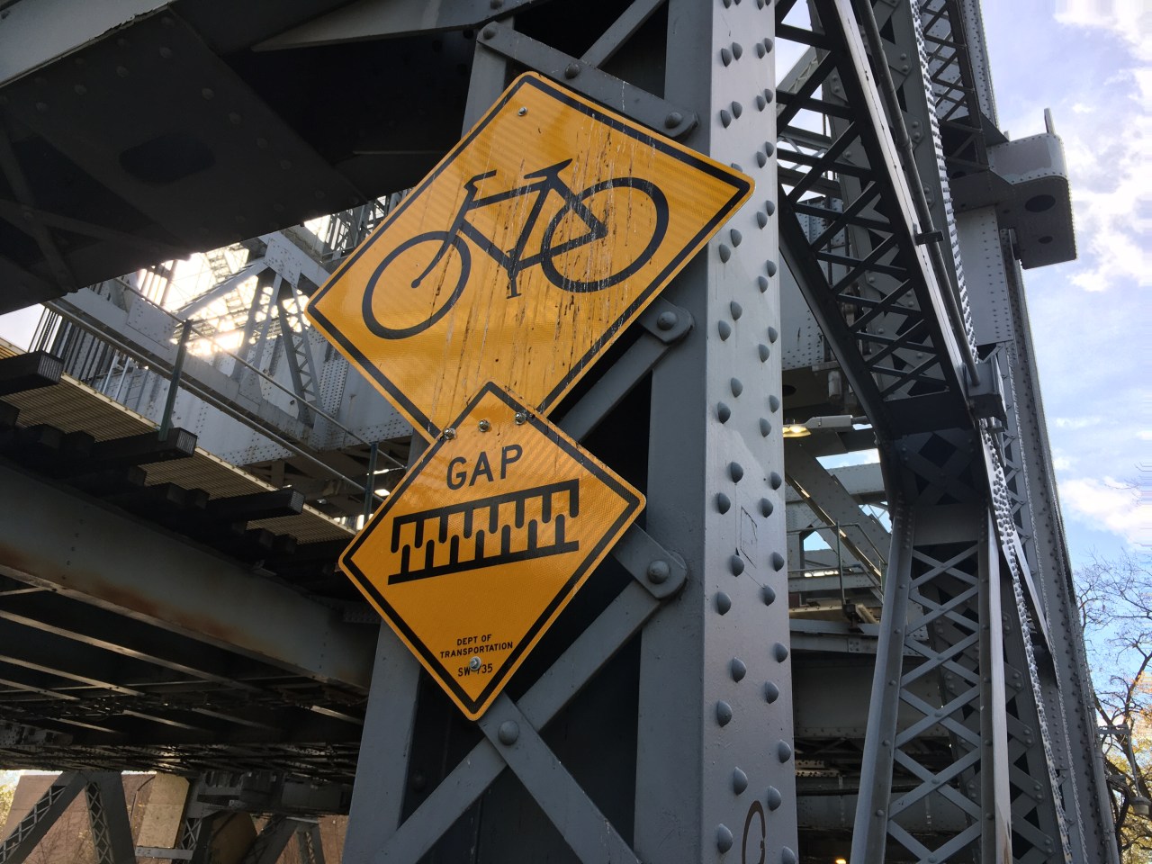 Signs warn bikers of the bridge's hazards. Photo: Eve Kessler