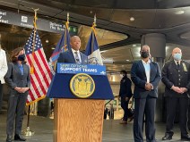 Governor Kathy Hochul (l), Mayor Eric Adams (center) and NYPD Commissioner Keechant Sewell (r) at Thursday's police-heavy announcement that police will not be tasked with arresting homeless people on the subway. Photo: Dave Colon
