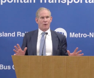 Lieber answers Duggan's question at the meeting.