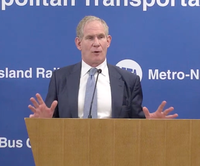 Lieber answers Duggan's question at the meeting.