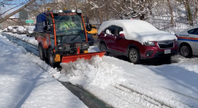 Caught in the wild! The Department of Sanitation's new narrow snow plow in its first test. Photo: Dave Colon