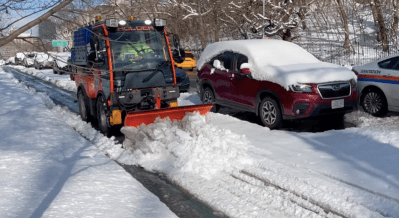 Caught in the wild! The Department of Sanitation's new narrow snow plow in its first test. Photo: Dave Colon