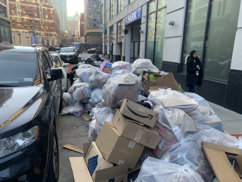 Welcome to New York, where pedestrians walk amid leaking, stinking garbage bags.